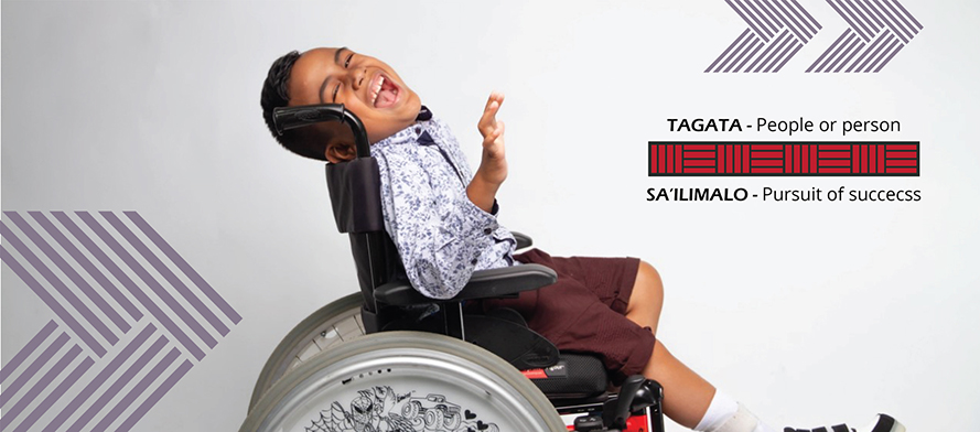 happy looking boy on wheel chair